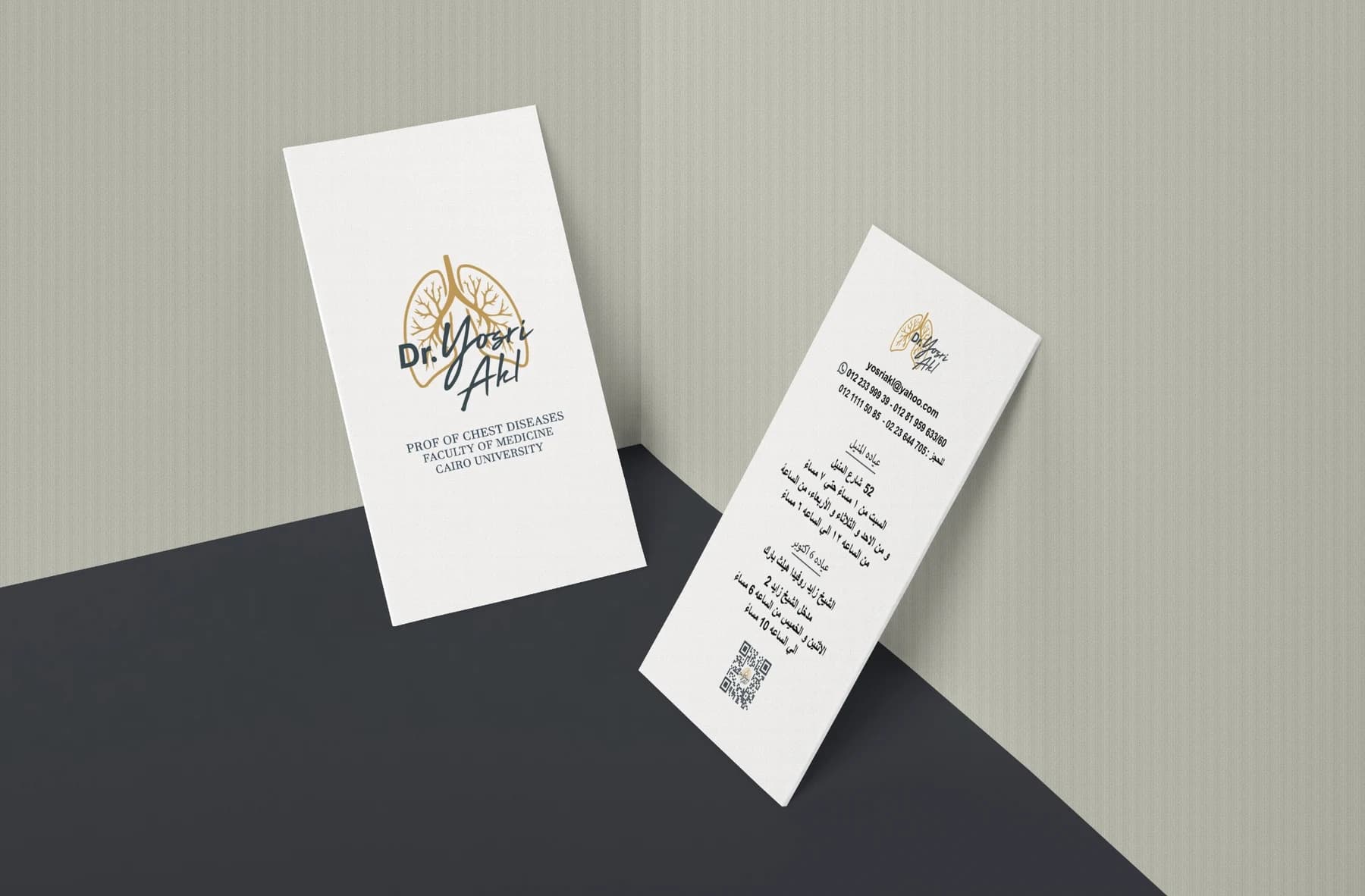 Dr. Yosri Akl clinic cards arranged in an angled printed mockup