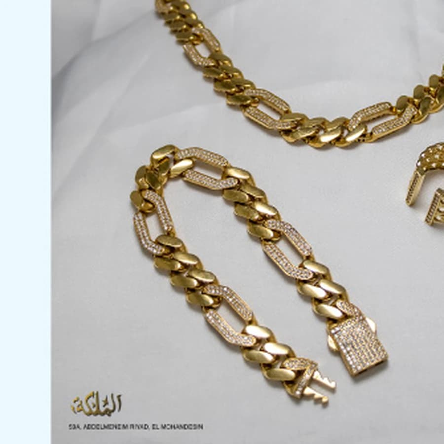 Gold chain and ring product arrangement for AL MALEKA Jewelry