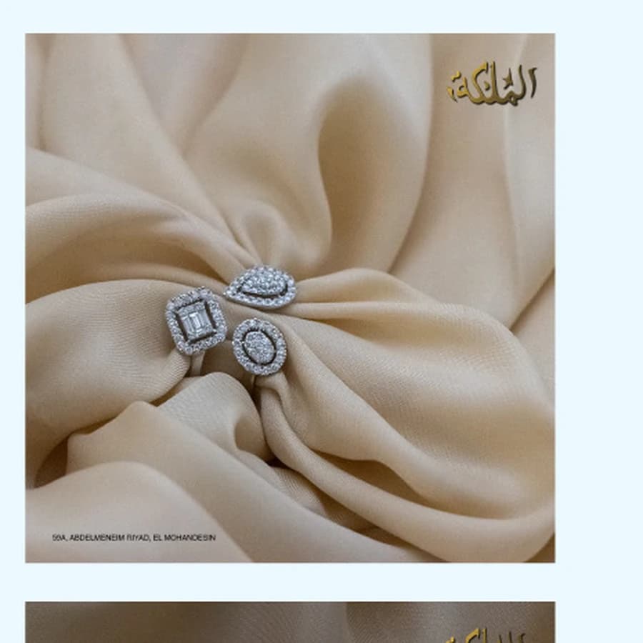 Diamond rings arranged on soft neutral fabric for AL MALEKA Jewelry